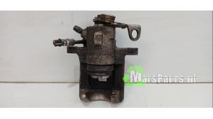 Używane Zacisk hamulcowy prawy tyl Volkswagen Polo V (6R) 1.4 16V Cena € 35,00 Procedura marży oferowane przez Autodemontagebedrijf De Mars