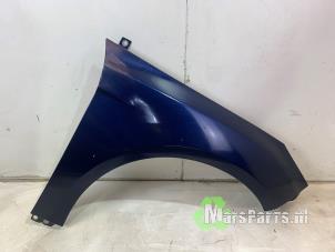 Używane Blotnik prawy przód Ford Focus 3 Wagon 1.0 Ti-VCT EcoBoost 12V 100 Cena € 75,00 Procedura marży oferowane przez Autodemontagebedrijf De Mars