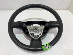 Begagnade Ratt Daihatsu Sirion 2 (M3) 1.3 16V DVVT Pris € 25,00 Marginaltabell erbjuds av Autodemontagebedrijf De Mars