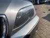 Strålkastare, vänster från en BMW 3 serie (E46/4) 316i 16V 2003