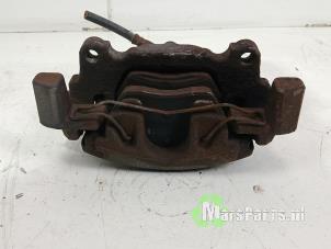 Używane Zacisk hamulcowy lewy przód Volkswagen Touran (1T1/T2) 1.6 FSI 16V Cena € 30,00 Procedura marży oferowane przez Autodemontagebedrijf De Mars