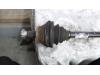 Aandrijfas links-voor van een Seat Ibiza ST (6J8) 1.2 TDI Ecomotive 2010