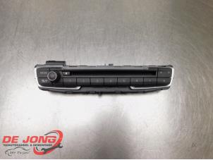 Begagnade Radiokontrollpanel BMW 2 serie Gran Tourer (F46) 218i 1.5 TwinPower Turbo 12V Pris € 28,00 Marginaltabell erbjuds av Autodemontagebedrijf de Jong