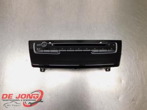 Begagnade Radiokontrollpanel BMW 2 serie Gran Tourer (F46) 218i 1.5 TwinPower Turbo 12V Pris € 28,00 Marginaltabell erbjuds av Autodemontagebedrijf de Jong