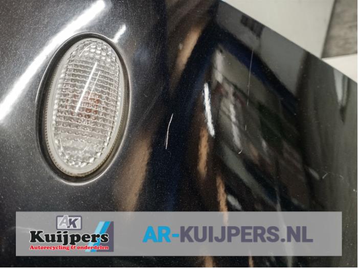 Framskärm, vänster från en Mazda 2 (NB/NC/ND/NE) 1.4 CiTD 2005