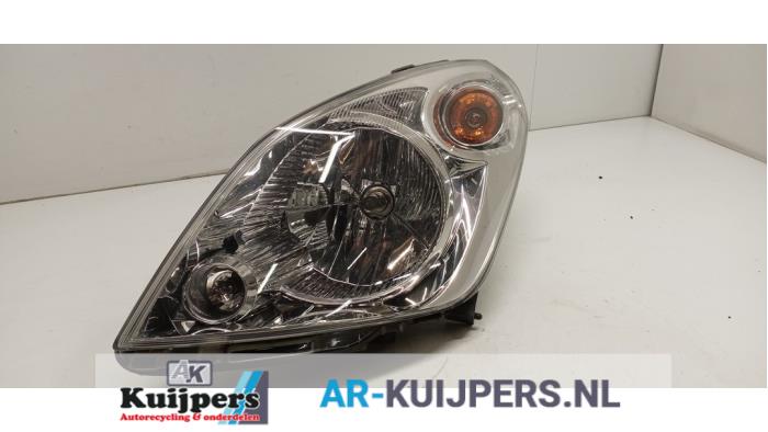 Strålkastare, vänster från en Suzuki Splash  2011