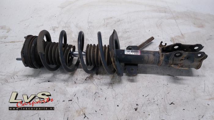 Mazda 2. Front shock absorber rod, left