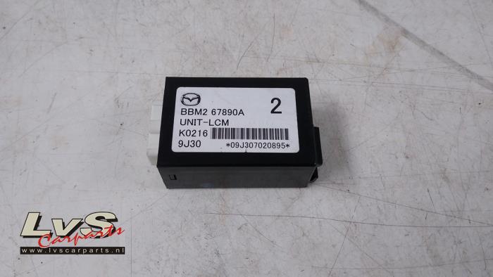 Mazda 3. Computer lighting module