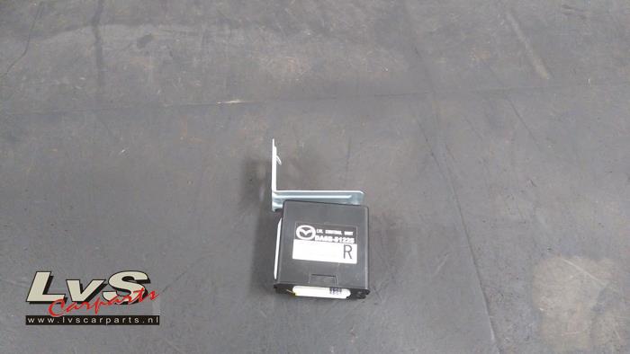 Mazda 2. Computer lighting module