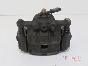 Gebruikte Remklauw (Tang) links-voor Ford Fiesta 6 (JA8) 1.0 SCI 12V 80 Prijs € 19,95 Margeregeling aangeboden door Focus Automotive