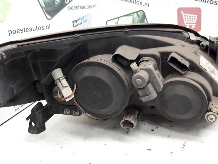 Strålkastare, vänster från en Nissan Primera Wagon (W12) 1.8 16V 2005