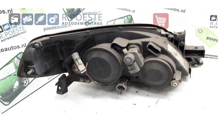 Strålkastare, vänster från en Nissan Primera Wagon (W12) 1.8 16V 2005