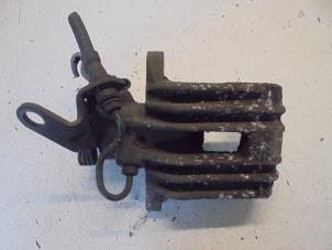 Begagnade Bakre bromsok, vänster Volkswagen Lupo (6X1) 1.4 60 Pris € 35,00 Marginaltabell erbjuds av Hans Auto Onderdelen