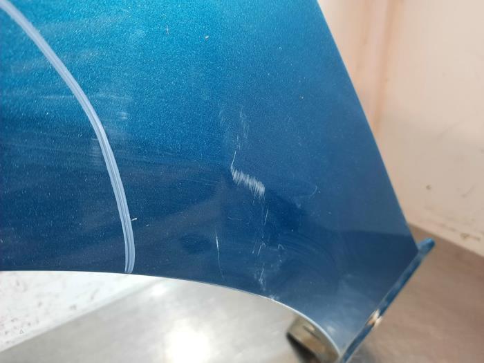 Framskärm, vänster från en Mazda 2 (DE) 1.3 16V MZR 2011