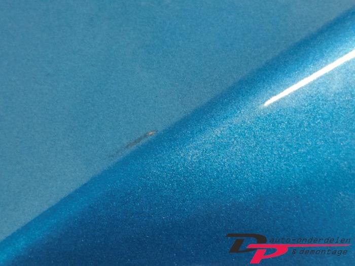 Framskärm, vänster från en Mazda 2 (DE) 1.3 16V MZR 2011