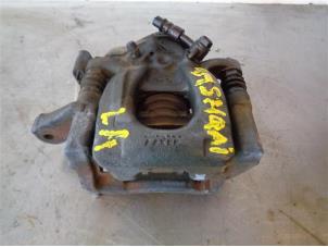 Używane Zacisk hamulcowy lewy tyl Nissan Qashqai (J11) Cena na żądanie oferowane przez Autohandel-Smet Gebroeders NV