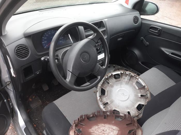 Daihatsu Cuore 1.0 12V DVVT Skrotfordon (2007, GRIJS)